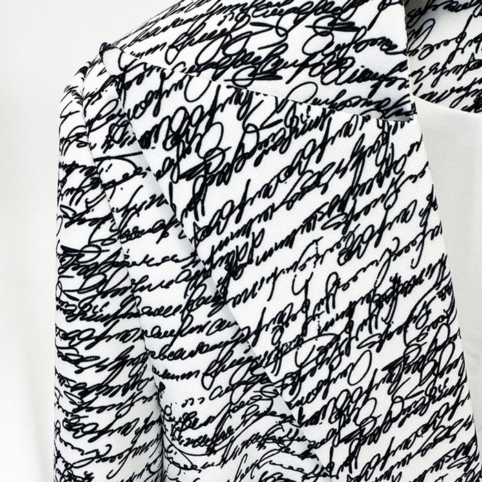 Textured black and white fabric with a pattern of black ink blots.