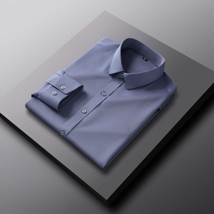 Folded light blue shirt on a gray surface