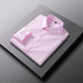 Pink dress shirt on a gray surface