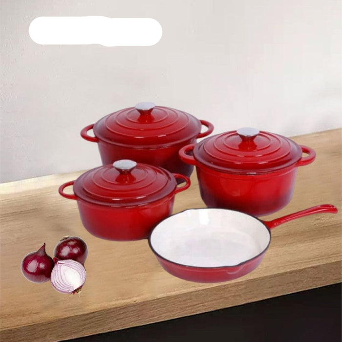Set of red enameled cookware on a wooden surface with onions.