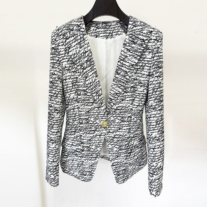 Black and white patterned blazer on a hanger against a white background
