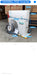 Air conditioning unit with technical specifications on a concrete floor