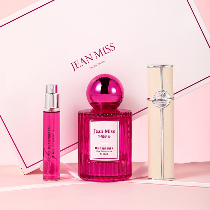 Three perfume bottles from Jean Miss on a pink background