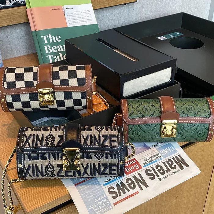 Three patterned handbags on a wooden surface with a newspaper underneath.
