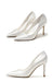 Pair of white high-heeled shoes on a white background