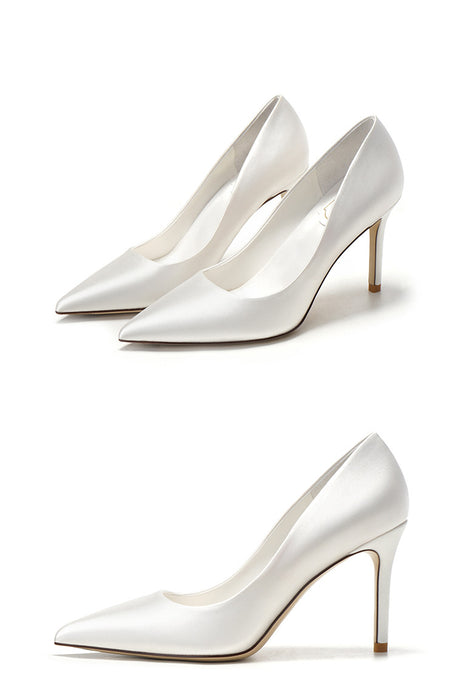 Pair of white high-heeled shoes on a white background