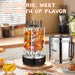 A countertop rotisserie grill set shown in a kitchen-like dining environment, with skewers cooking inside a clear cylindrical rotisserie chamber and a separate stainless steel bucket-style burner or smoker component beside it. Large overlaid text at the top reads 'ROTISSERIE, MEET THE BIRTH OF FLAVOR'.