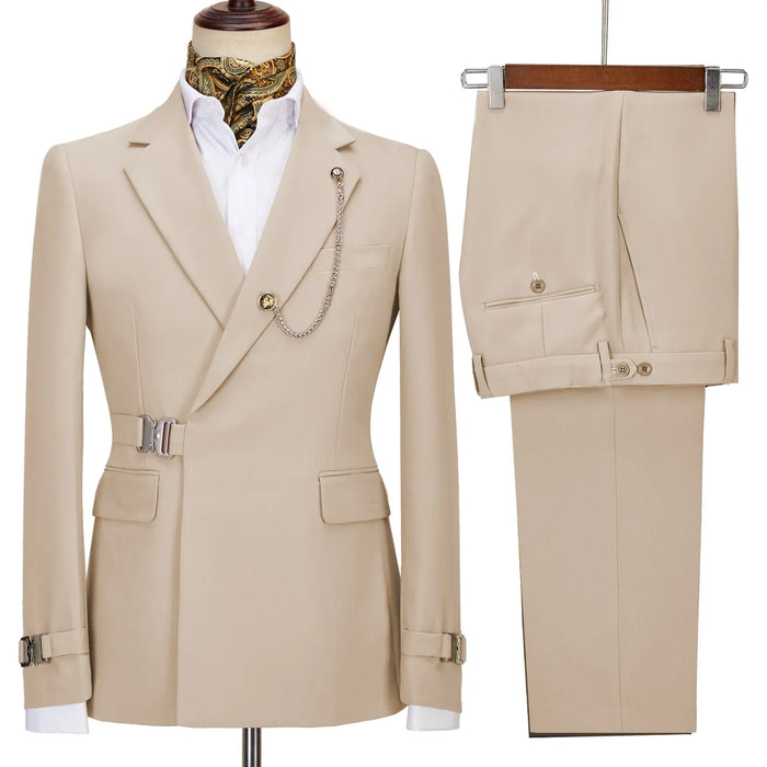 Beige suit jacket and pants on a mannequin and hanger against a white background