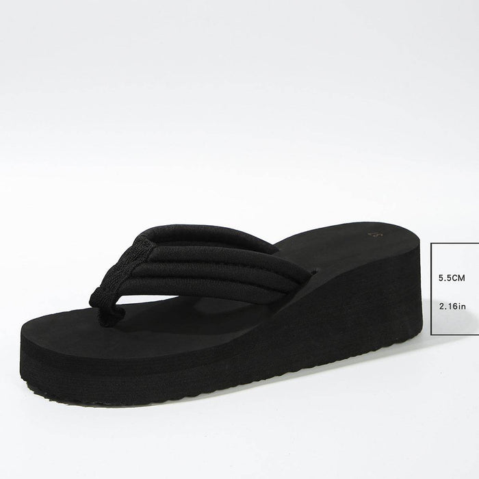 Black wedge sandal on a white background