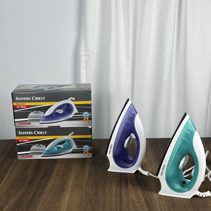 Two steam irons on a wooden surface with their packaging in the background.