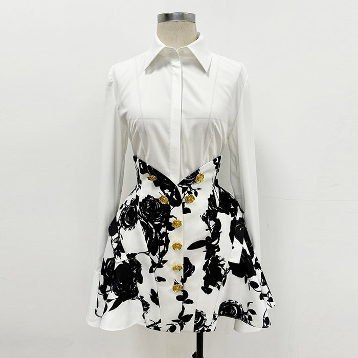 White shirt with black floral pattern and gold buttons on a mannequin against a white background