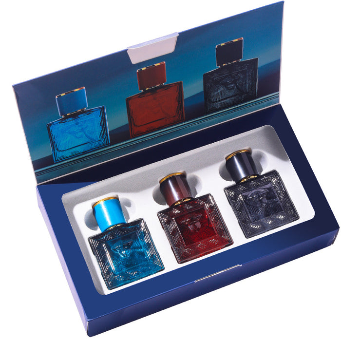 Set of three perfume bottles in a display box with a blue and red design.