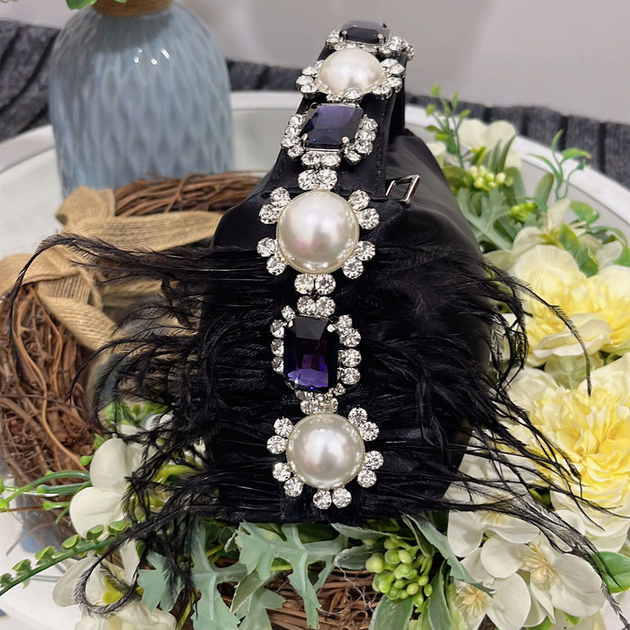 Decorative hair clip with pearls and feathers on a floral background