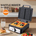 Waffle maker with waffles on a kitchen counter, showing 1600W power rating.