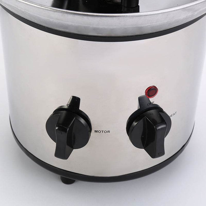 Stainless steel chocolate fountain on a white background