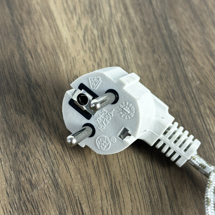 White electrical plug on a wooden surface