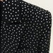 Black blazer with white polka dot pattern on a neutral background