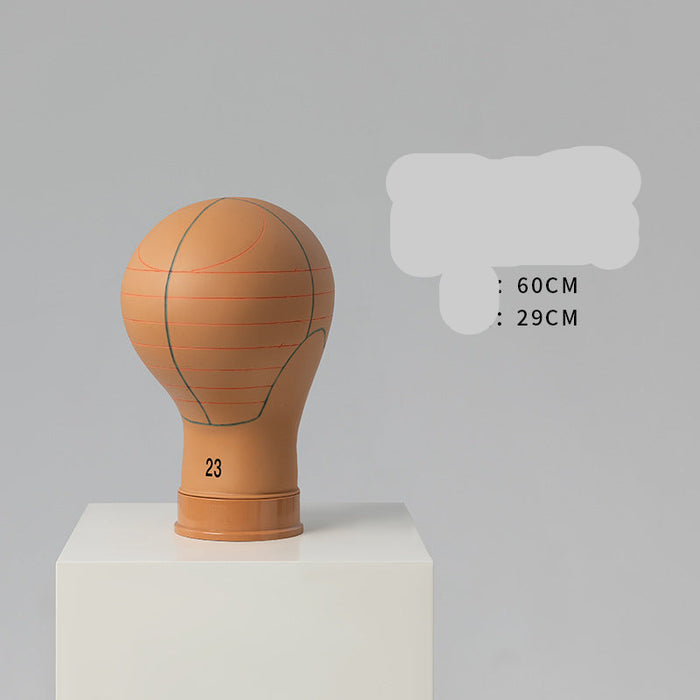 Basketball-shaped mannequin head on a gray background with text indicating dimensions.
