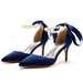 Blue high-heeled shoes with pearl straps on a white background