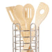 Set of wooden utensils in a metal holder on a white background