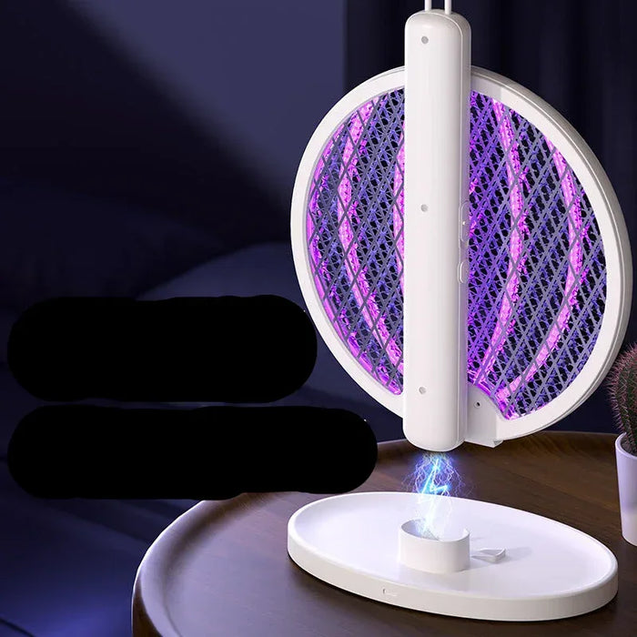 Electronic mosquito zapper with charging base on a dark surface