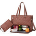 Brown quilted handbag with a smaller pouch, containing snacks and fruits on a white background