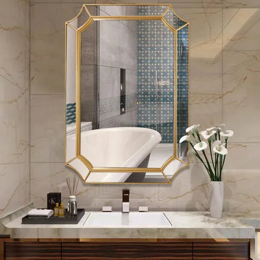 Bathroom vanity with a large mirror, sink, and decorative elements.