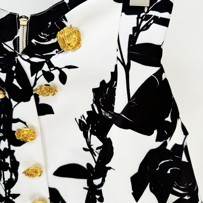 Black and white floral patterned fabric with gold buttons on a white background