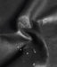 Close-up of black leather texture with water droplets