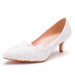 White lace high-heeled shoe on a white background