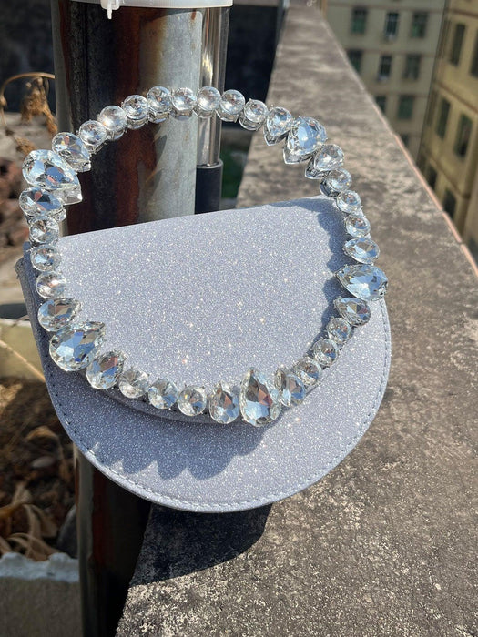 Crystal bracelet on a gray surface with a blurred background