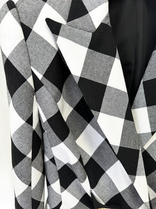 Black and white checkered fabric with a patterned texture