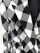 Black and white checkered fabric with a patterned texture