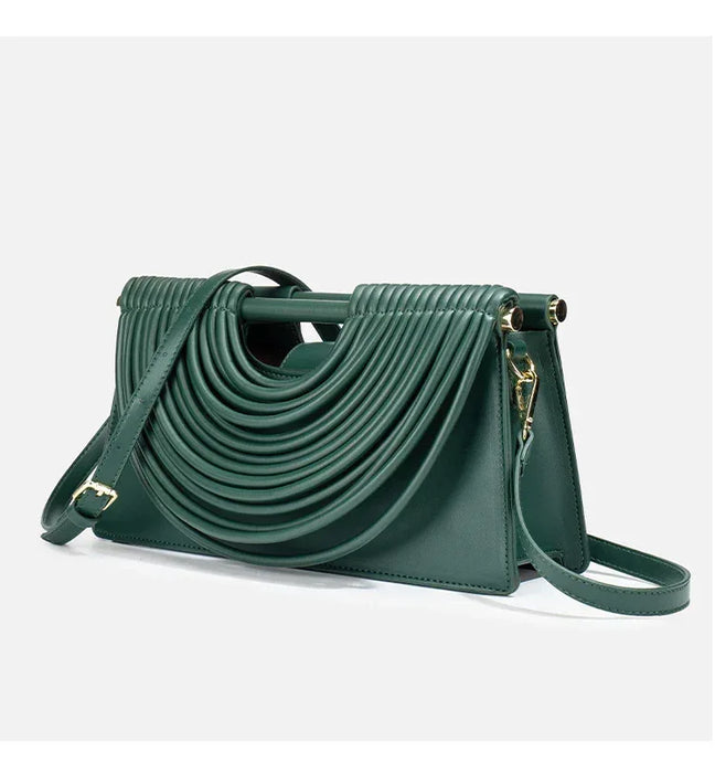 Green handbag with a unique design on a white background