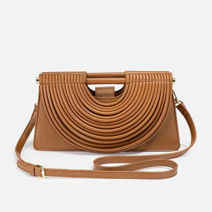 Brown handbag with a unique design on a light gray background