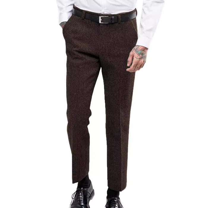 Brown dress pants worn by a person on a white background