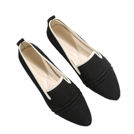 Pair of black loafers on a white background
