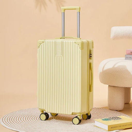 Yellow suitcase on a beige surface with a soft chair and book in the background