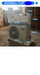 Air conditioning unit with dimensions and specifications displayed on a warehouse floor.