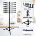Black music stand with adjustable height, tripod design, and foldable feature on a white background.