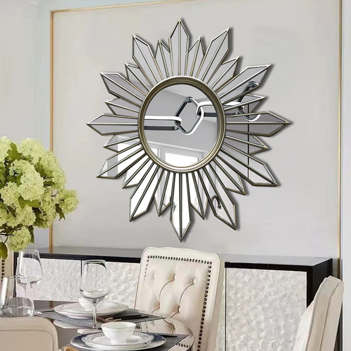Decorative wall mirror with sunburst design in a dining room setting