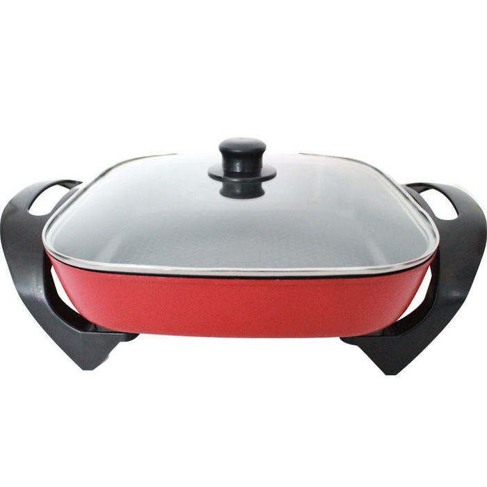 Red electric skillet with a glass lid on a white background