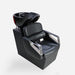 Black salon shampoo chair with bowl on a white background