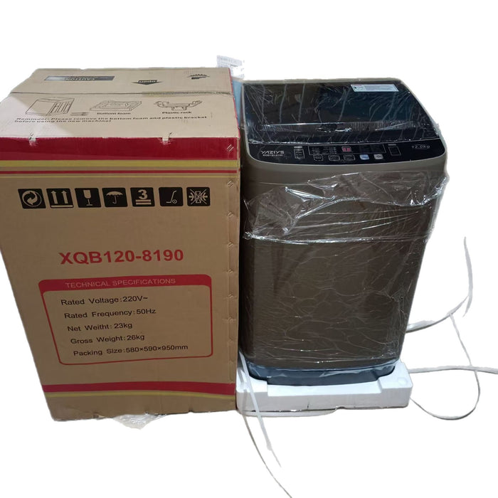 Washing machine with plastic wrap next to its packaging box on a white background