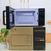 F. Blümlein microwave oven shown open, resting on top of its cardboard packaging box.