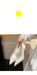 White high-heeled shoes held by a hand with text overlay on a black background