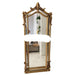 Decorative gold-framed mirror on a white background