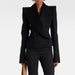Black suit jacket and pants on a white background
