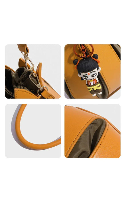 Orange handbag with a character keychain on a white background