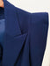 Close-up of a blue blazer with a white background